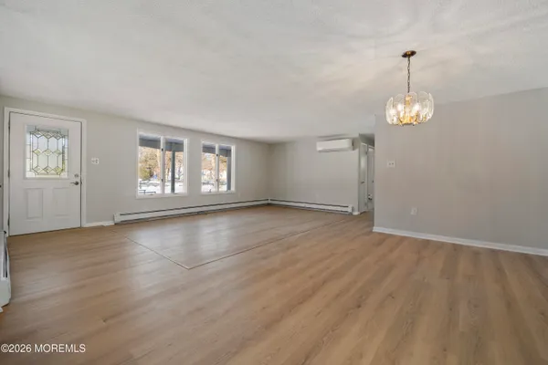 a kitchen with stainless steel appliances granite countertop a stove refrigerator and cabinets