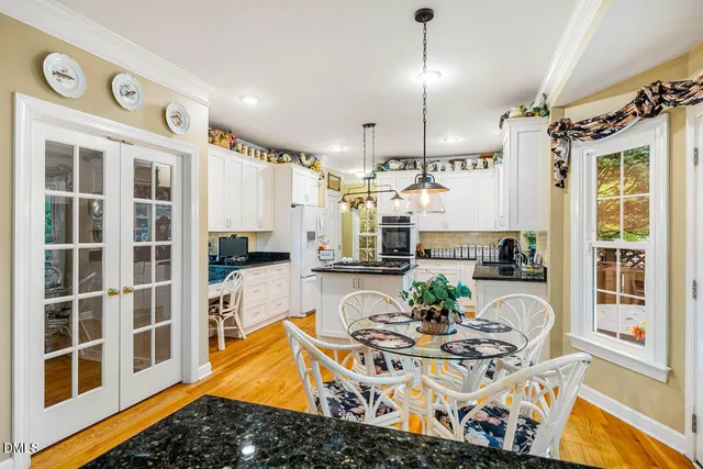a kitchen with stainless steel appliances granite countertop a stove and a refrigerator