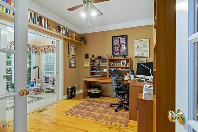 a bedroom with a bed furniture and a chandelier