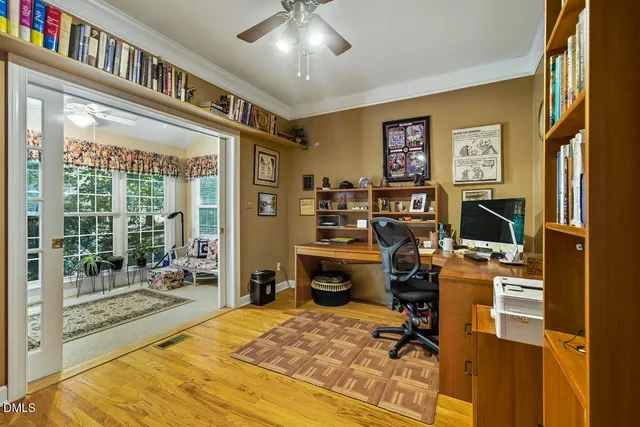 a bedroom with furniture and a large window