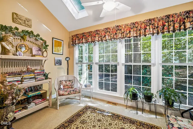 a view of a very nice looking living room with a large window