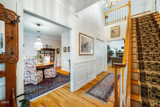 a spacious bedroom with bed and a chandelier