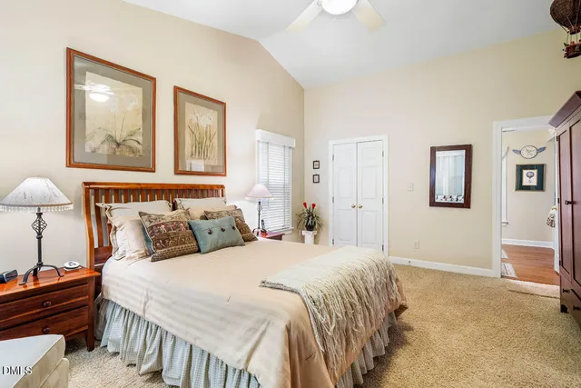 a view of walk in closet with clothes