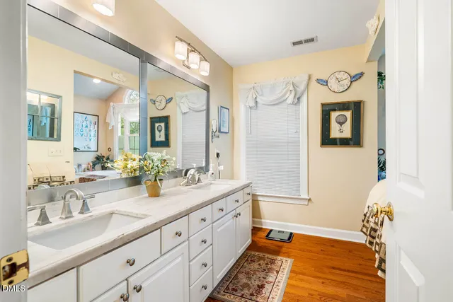 a bedroom with a bed and a table with chair