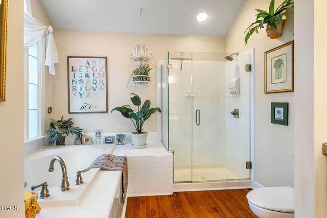 a bedroom with two beds and a chandelier