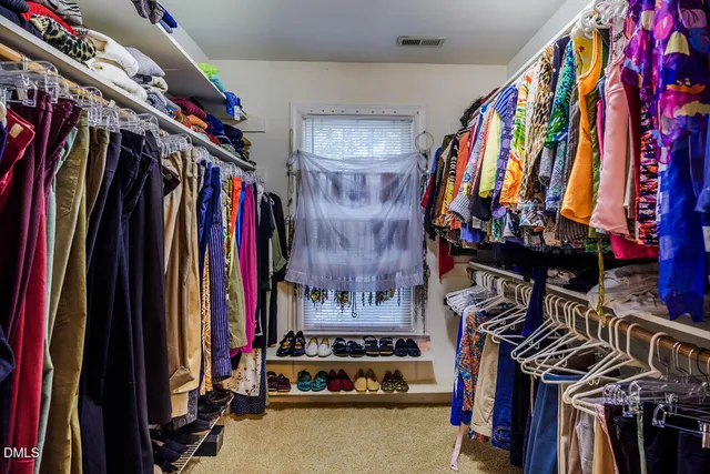 a bedroom with a bed and furniture