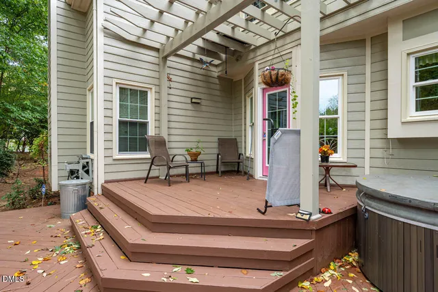 a view of a backyard with large trees and plants