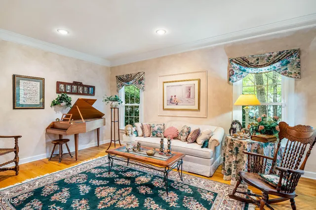 a living room with furniture and a rug