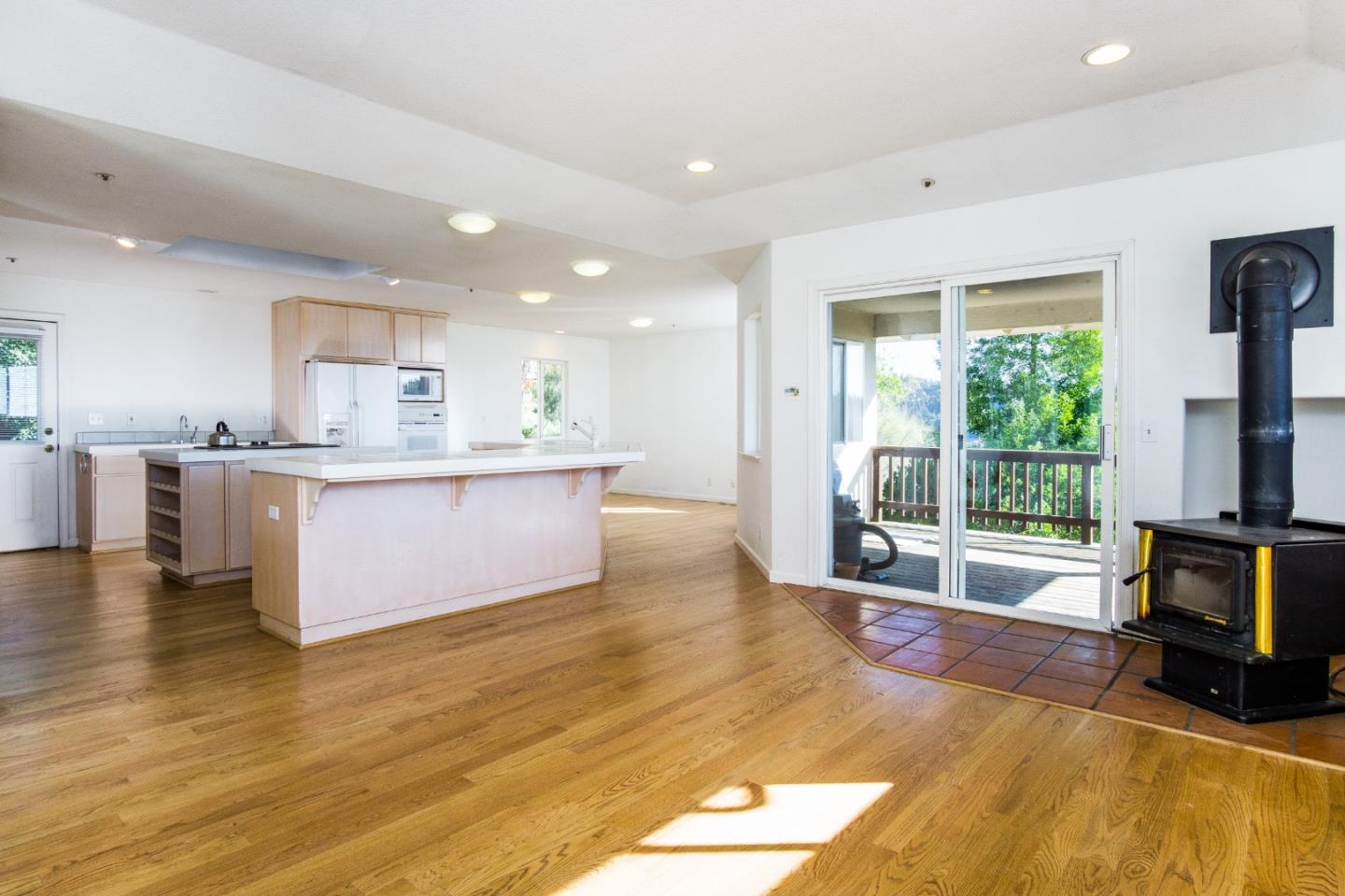 2494 North Rodeo Gulch Road Soquel, CA 95073 - Photo 17 of 34 a living room with stainless steel appliances granite countertop a stove top oven a sink dishwasher and cabinets next to a window