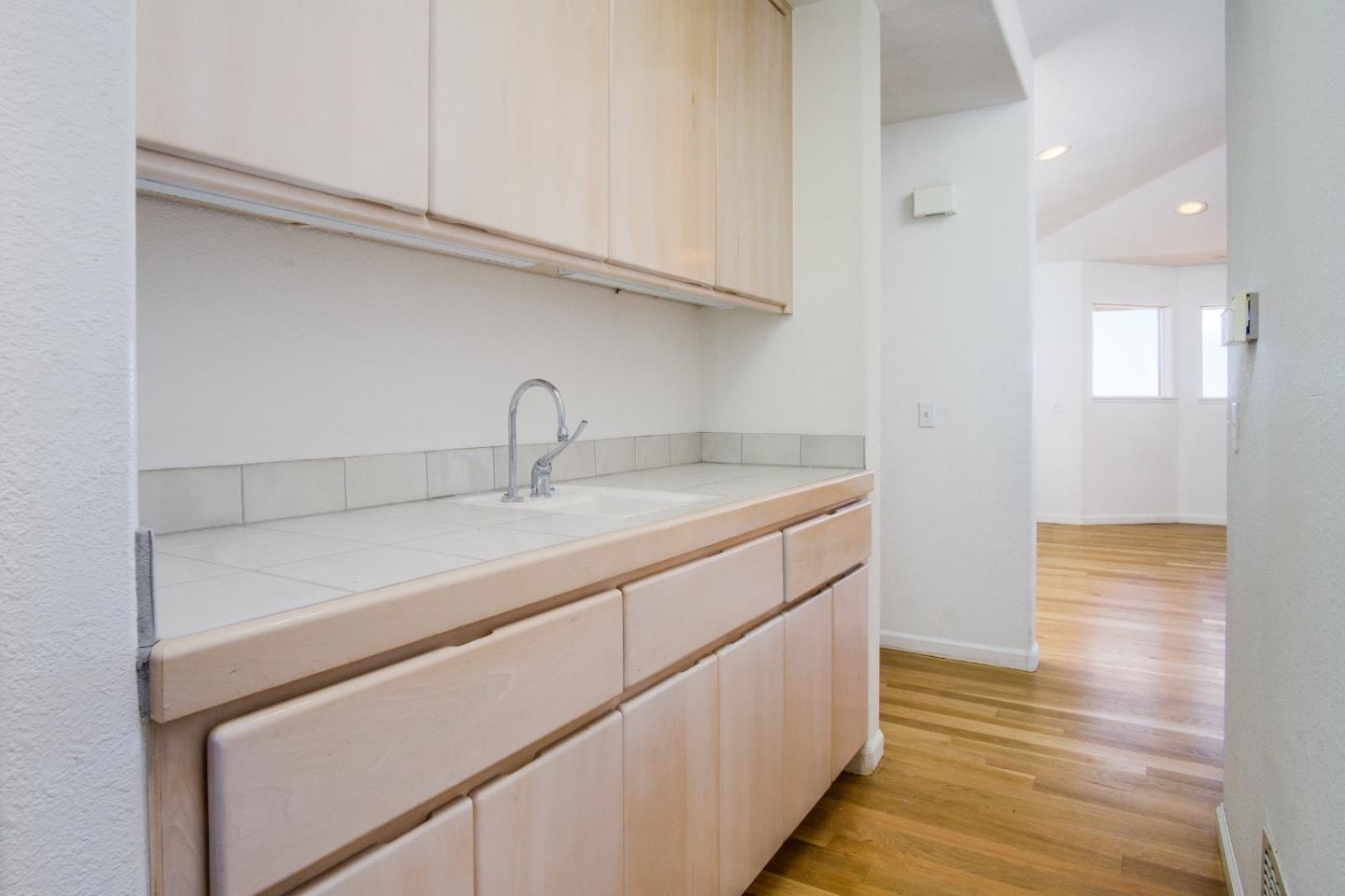 2494 North Rodeo Gulch Road Soquel, CA 95073 - Photo 20 of 34 a kitchen with a sink and a refrigerator