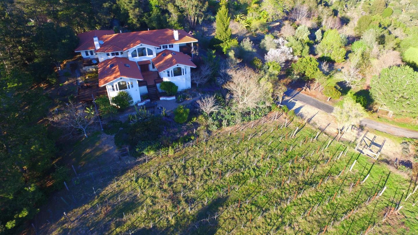 2494 North Rodeo Gulch Road Soquel, CA 95073 - Photo 3 of 34 a building view with swimming pool and lawn chairs