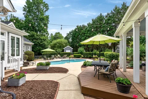 a view of a backyard with sitting area and furniture