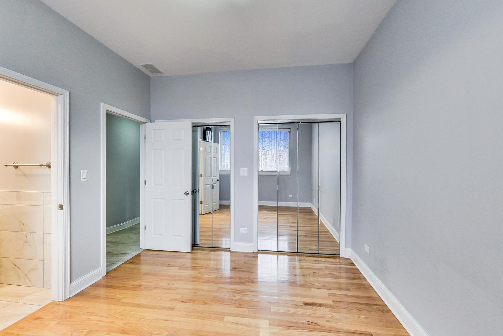 2325 West Taylor Street, Unit 2 Chicago, IL 60612 - Photo 11 of 19 a view of a hallway with wooden floor and a bathroom
