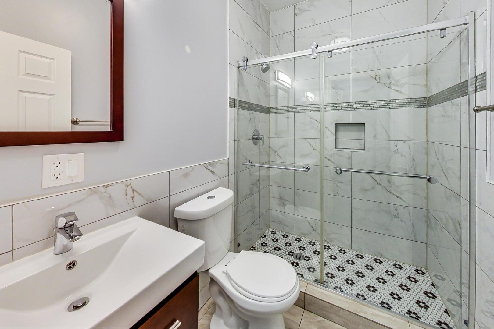 2325 West Taylor Street, Unit 2 Chicago, IL 60612 - Photo 17 of 19 a bathroom with a sink toilet and shower