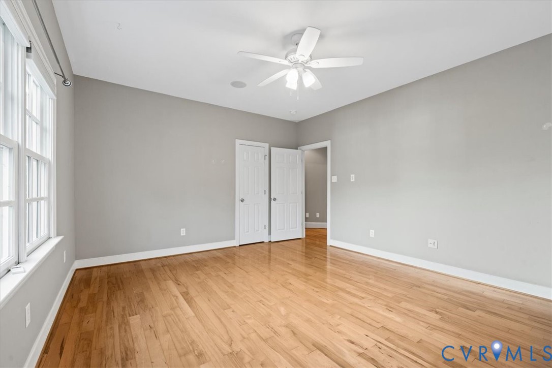 3308 Yarding Way Toano, VA 23168 - Photo 56 of 83 an empty room with wooden floor and windows
