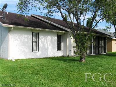 13227 Heather Ridge Loop Fort Myers, FL 33966 - Photo 9 of 10 a house with garden in front of it