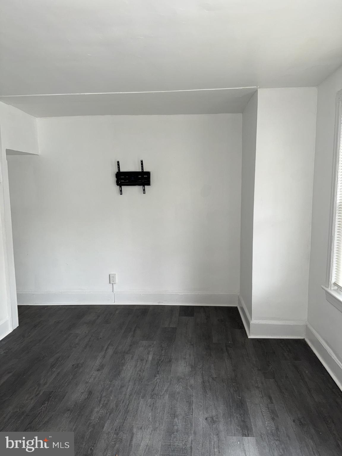 536 Keystone Avenue Darby, PA 19023 - Photo 3 of 11 an empty room with wooden floor and window