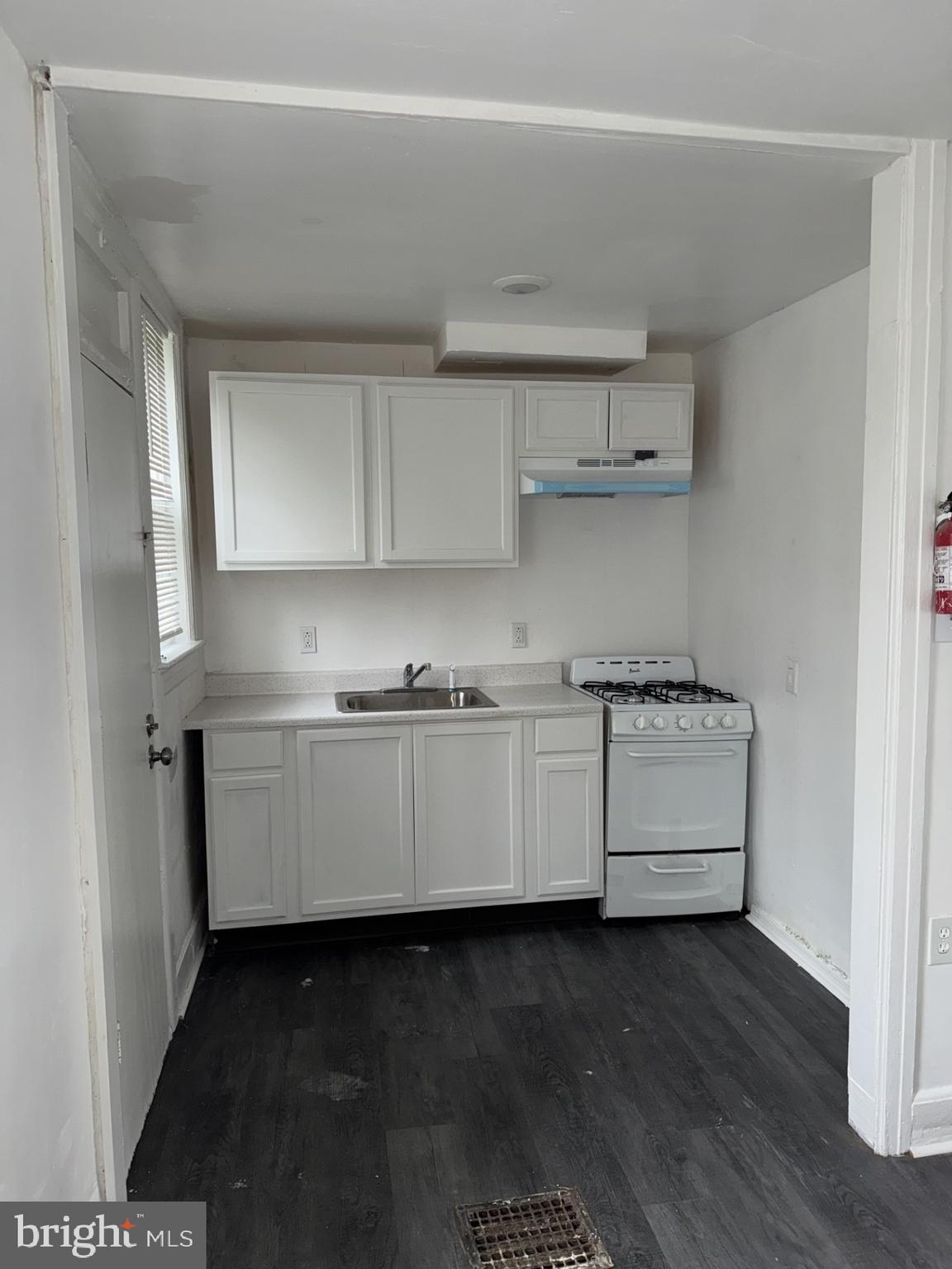 536 Keystone Avenue Darby, PA 19023 - Photo 5 of 11 a kitchen with cabinets appliances and a wooden floor