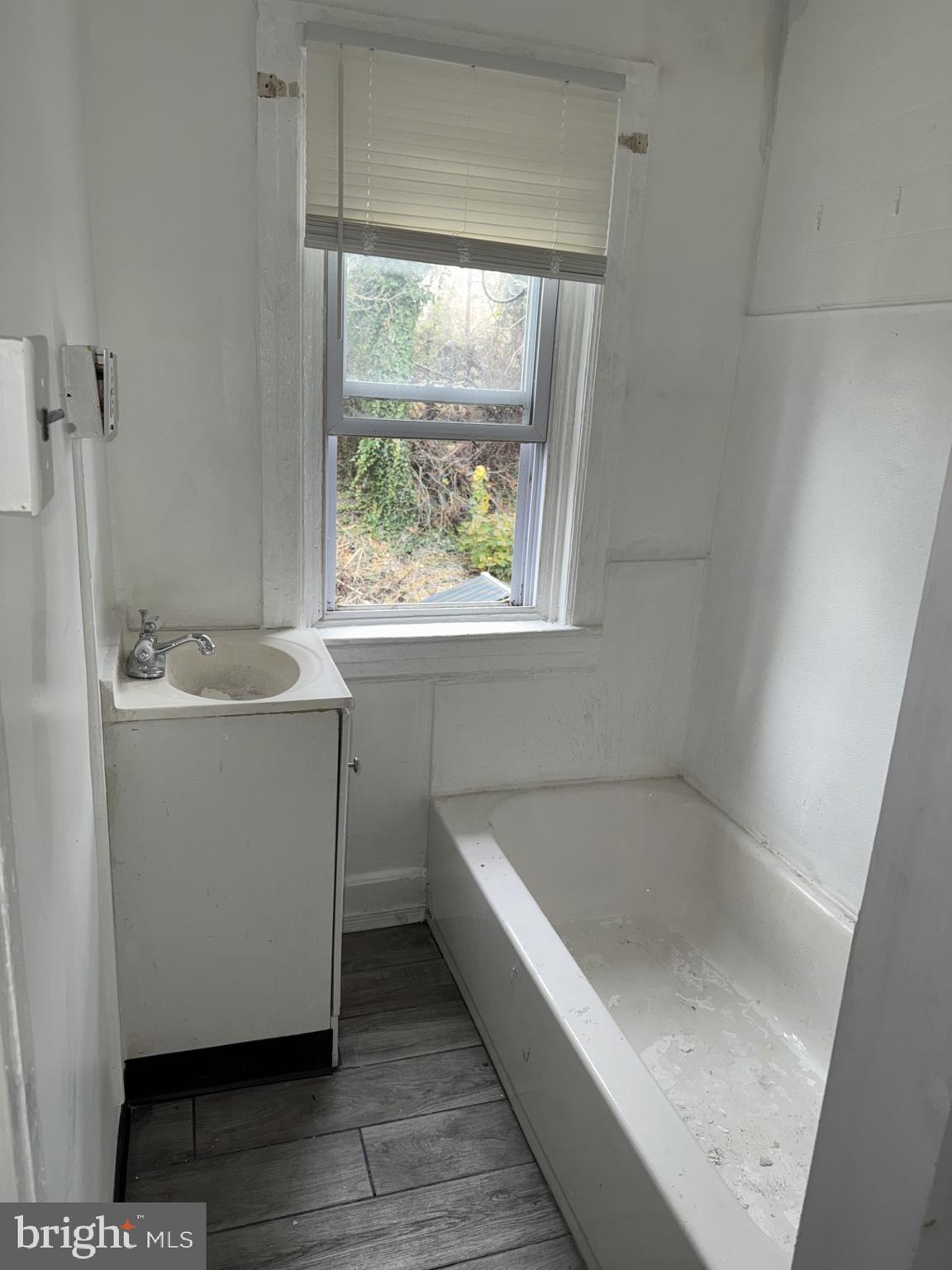 536 Keystone Avenue Darby, PA 19023 - Photo 9 of 11 a bathroom with a tub sink and window