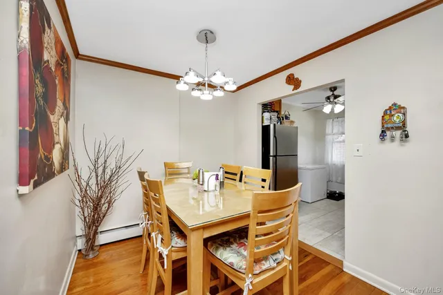 a kitchen with stainless steel appliances granite countertop a refrigerator a stove and a sink