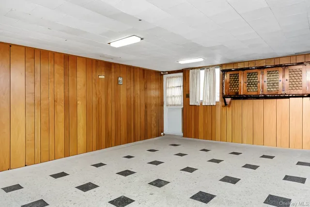 a kitchen with a sink a stove a refrigerator and cabinets