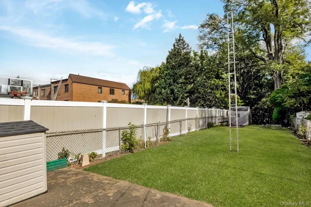 a view of residential houses with outdoor space and swimming pool