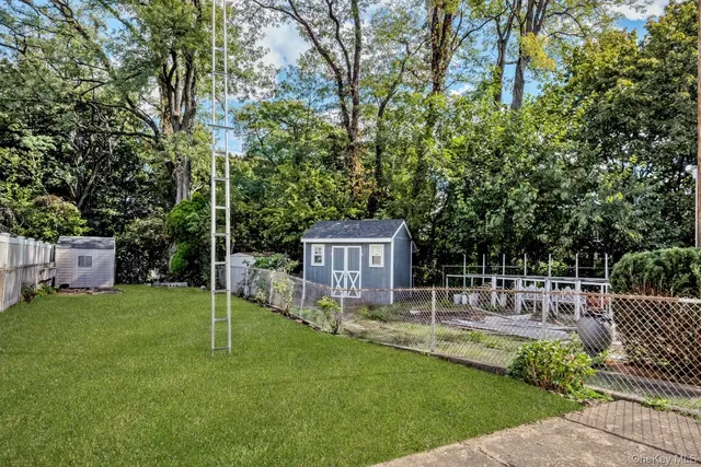 a front view of a building with red door