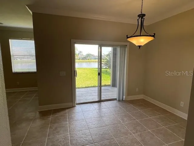 a view of a livingroom with a ceiling fan and window