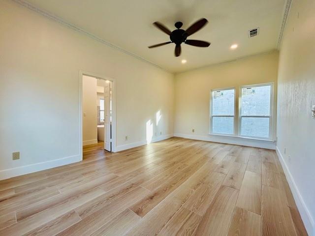 17119 Upper Bay Road Addison, TX 75001 - Photo 24 of 29 an empty room with wooden floor and windows