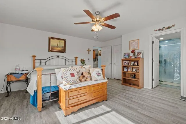 a bed room with furniture and a wooden floor