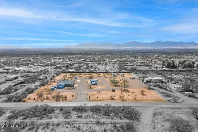 an aerial view of residential building and ocean view