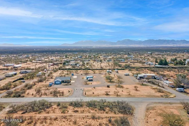 an aerial view of residential building and ocean