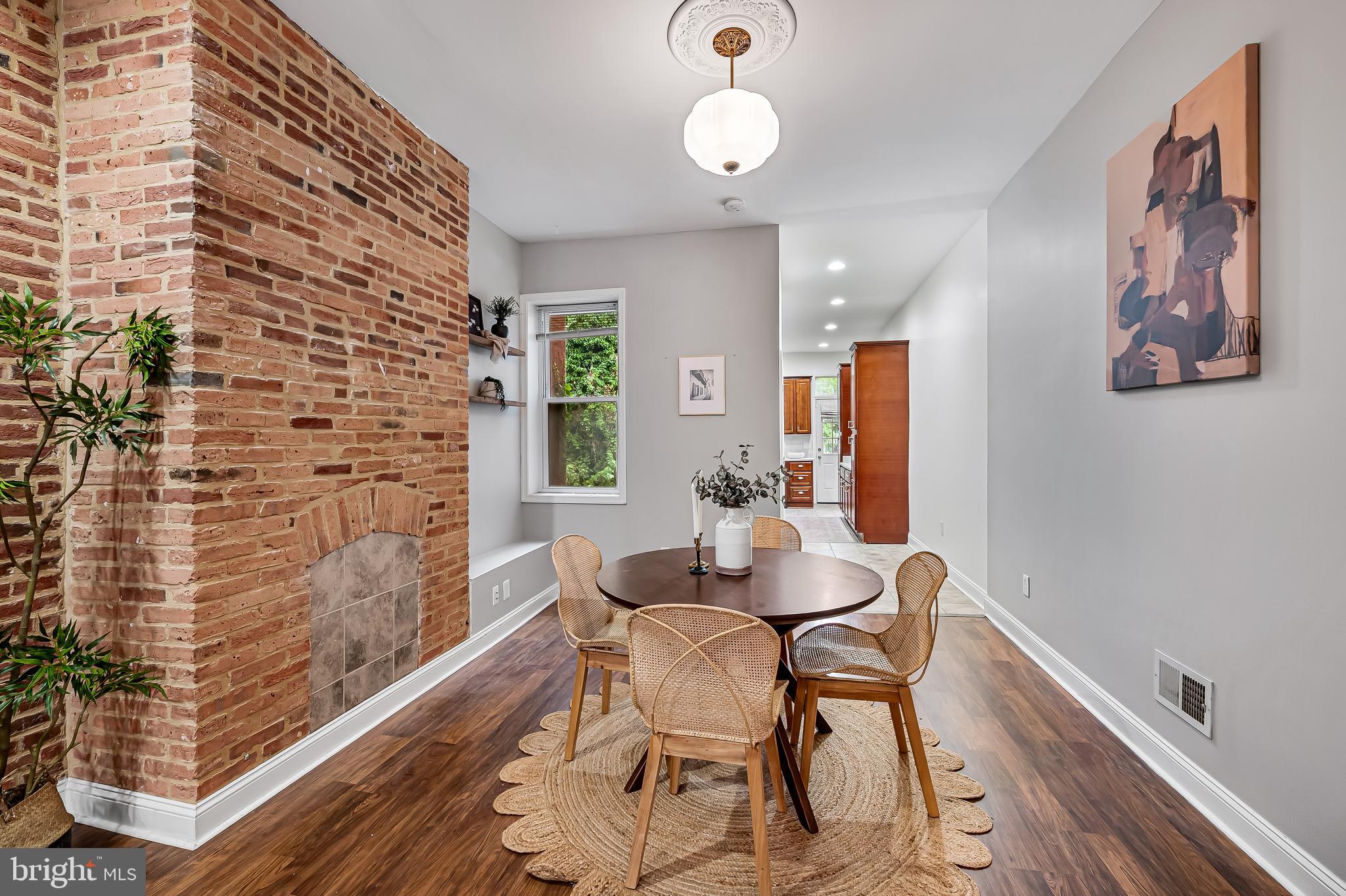 2425 North Calvert Street Baltimore, MD 21218 - Photo 9 of 44 a dining room with furniture and window
