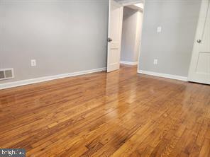 1126 48th Place Northeast Washington, DC 20019 - Photo 4 of 14 wooden floor in an empty room
