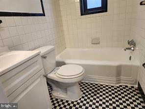 1126 48th Place Northeast Washington, DC 20019 - Photo 9 of 14 a bathroom with a toilet a sink and a bathtub