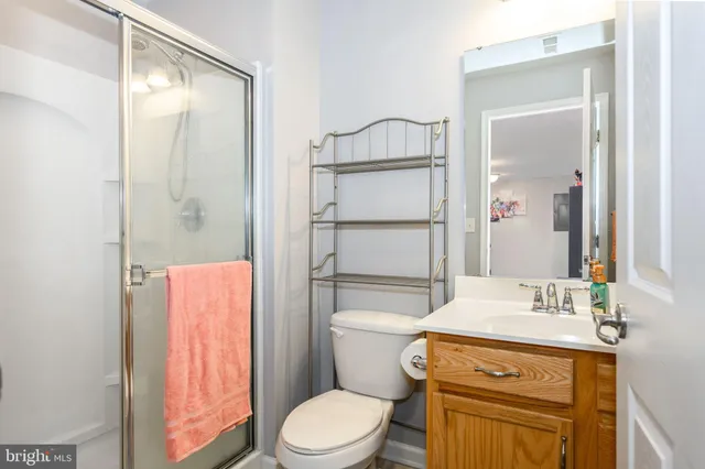 a view of a house with a big yard and large trees