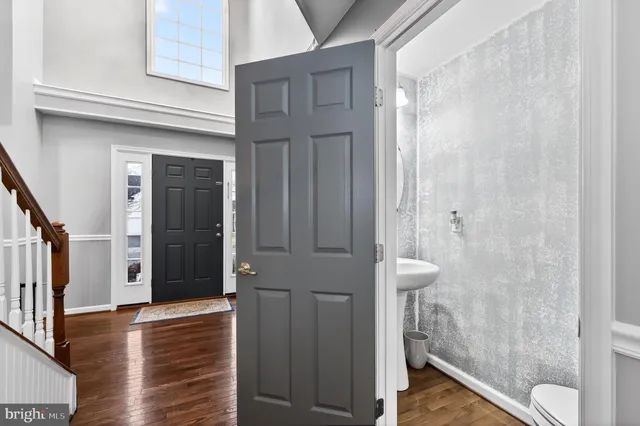 a house view with swimming pool and garden space