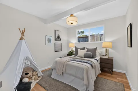 a bedroom with bed and a window