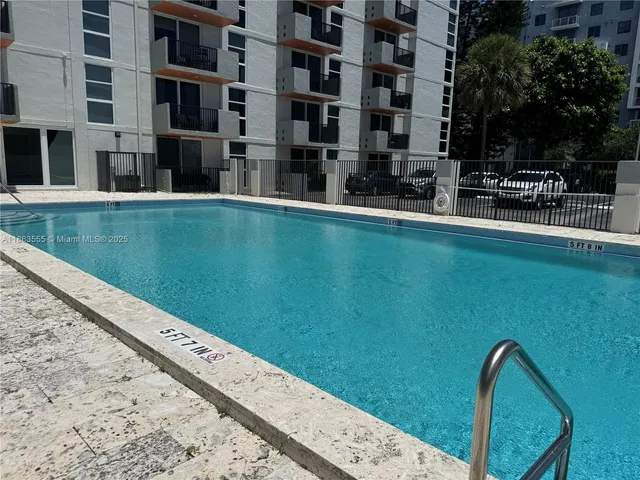 a view of swimming pool with a yard