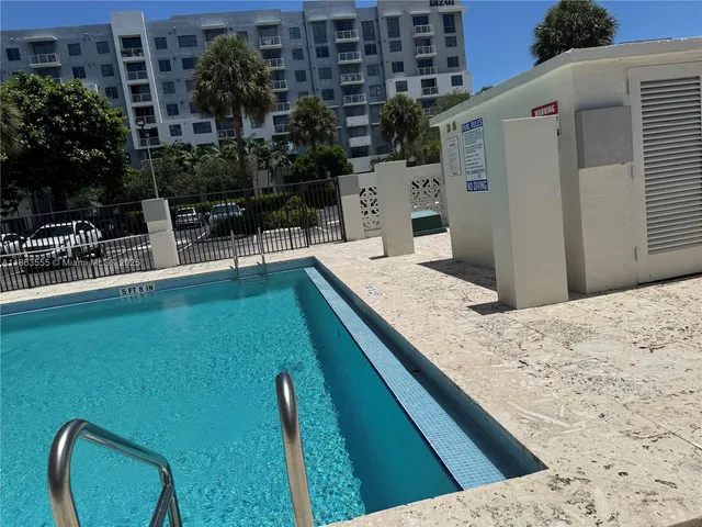 a view of swimming pool with a lounge chair