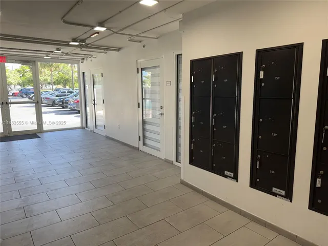 a couple of cars parked in front of a house
