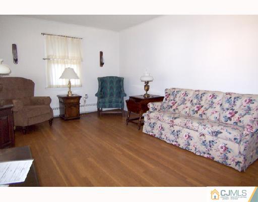 185 South Hill Road Colonia, NJ 07067 - Photo 2 of 10 a living room with furniture and a lamp