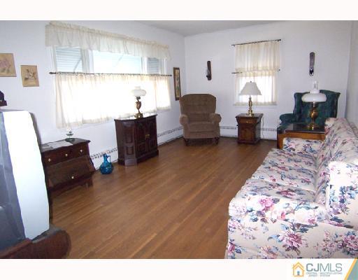 185 South Hill Road Colonia, NJ 07067 - Photo 3 of 10 a living room with furniture and a large window