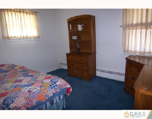 185 South Hill Road Colonia, NJ 07067 - Photo 6 of 10 a bedroom with a bed and window