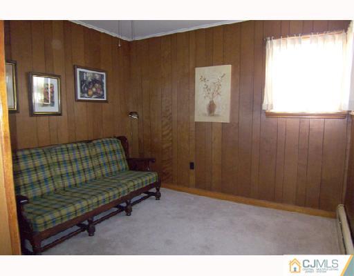 185 South Hill Road Colonia, NJ 07067 - Photo 7 of 10 a bedroom with a bed and a window