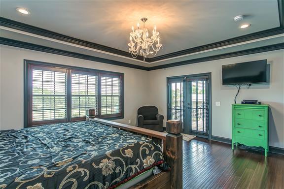 871 Franklin Road Gallatin, TN 37066 - Photo 13 of 30 a bedroom with a bed and a flat screen tv