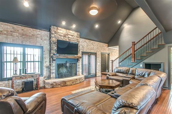 871 Franklin Road Gallatin, TN 37066 - Photo 6 of 30 a living room with furniture a flat screen tv and a large window