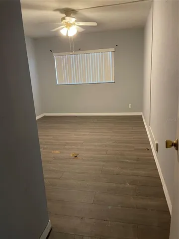 a kitchen with a refrigerator and a stove