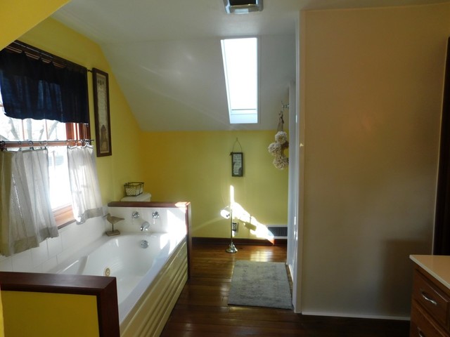 616 Woolf Court Rochelle, IL 61068 - Photo 22 of 34 a en suite bathroom with a sink and a mirror
