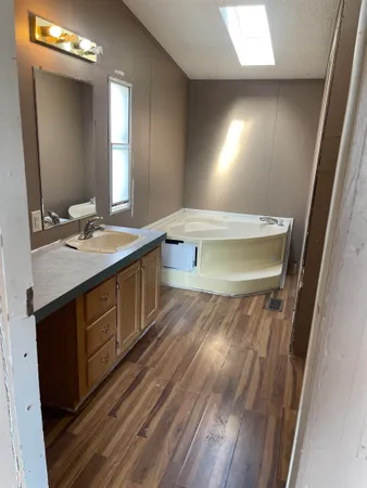 a bathroom with a sink and a mirror